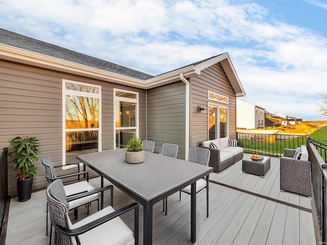 wooden terrace featuring an outdoor hangout area