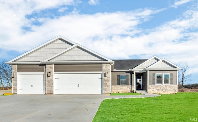 craftsman-style house featuring a garage and a front lawn