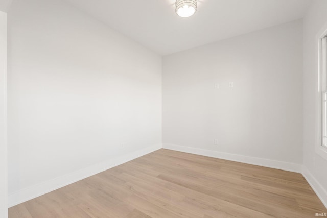 unfurnished room with light hardwood / wood-style floors