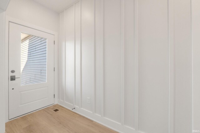 doorway to outside featuring light wood-type flooring