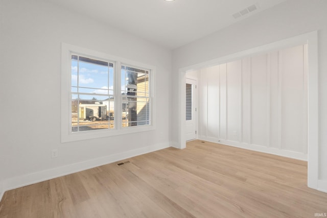 unfurnished room with light hardwood / wood-style flooring