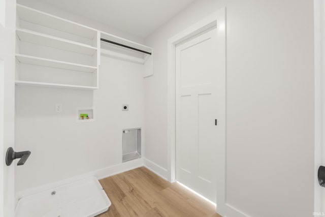 laundry room with electric dryer hookup, washer hookup, and light wood-type flooring