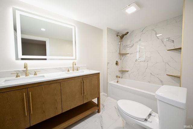 full bathroom featuring vanity, toilet, and tiled shower / bath combo