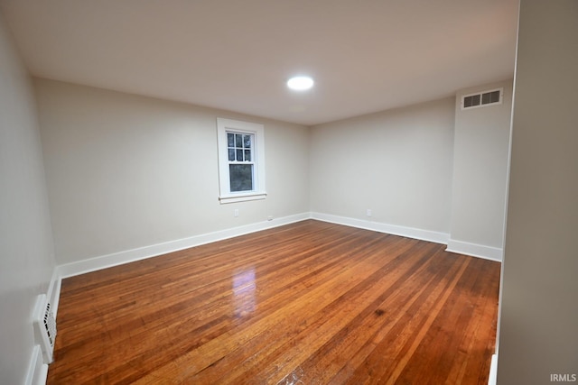 unfurnished room featuring hardwood / wood-style floors