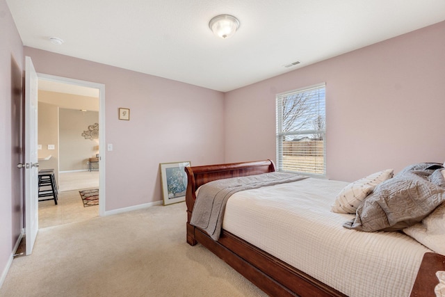 bedroom featuring light colored carpet