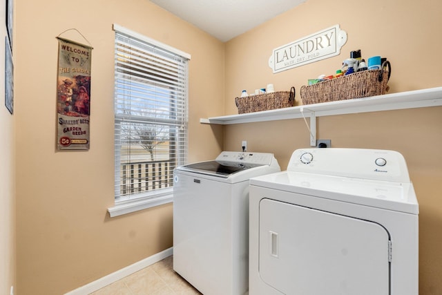 clothes washing area featuring washing machine and dryer and light tile patterned flooring