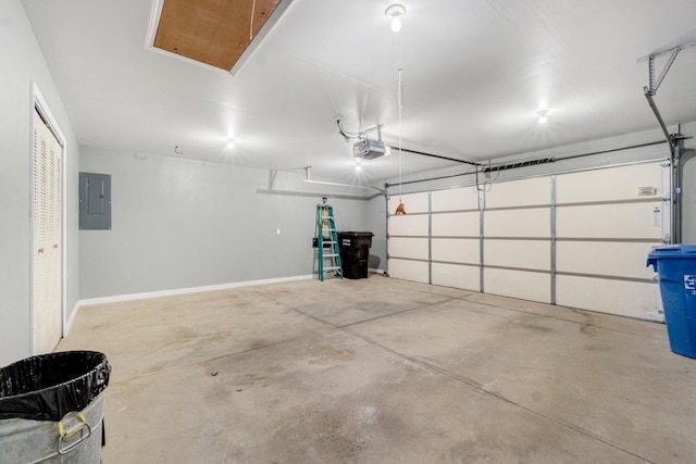 garage with a garage door opener and electric panel