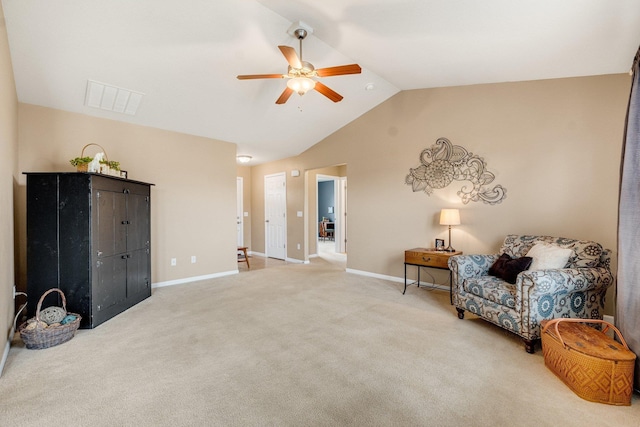 living area with ceiling fan, lofted ceiling, and carpet flooring