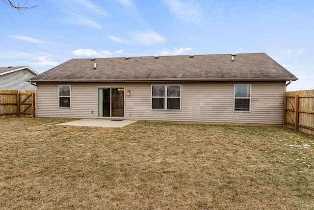 back of property featuring a lawn and a patio area