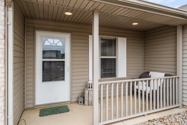 doorway to property featuring covered porch