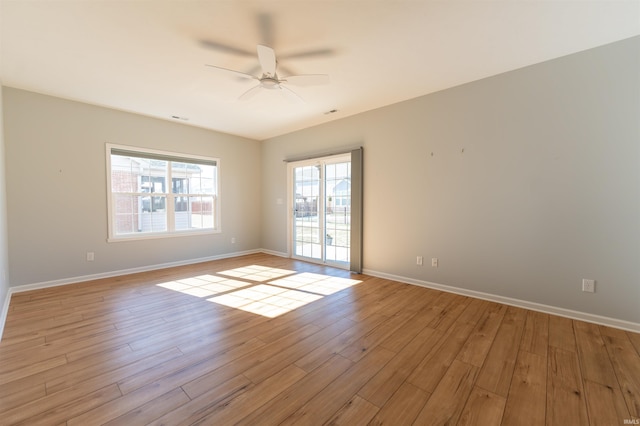 spare room with ceiling fan and light hardwood / wood-style flooring