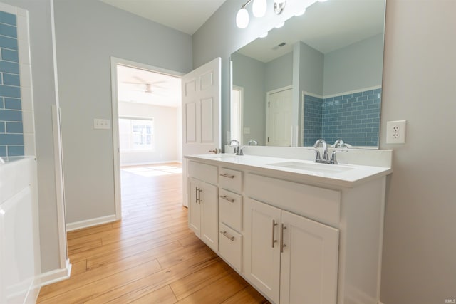 bathroom with hardwood / wood-style flooring and vanity