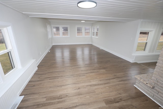 unfurnished room with dark hardwood / wood-style floors