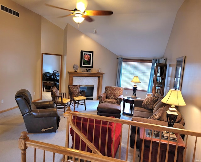 carpeted living room featuring ceiling fan and vaulted ceiling