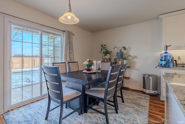 dining room with wood-type flooring