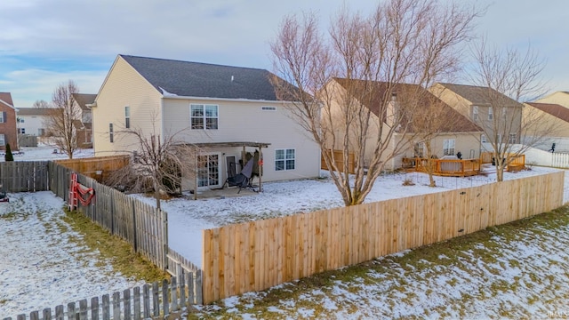 view of snow covered house