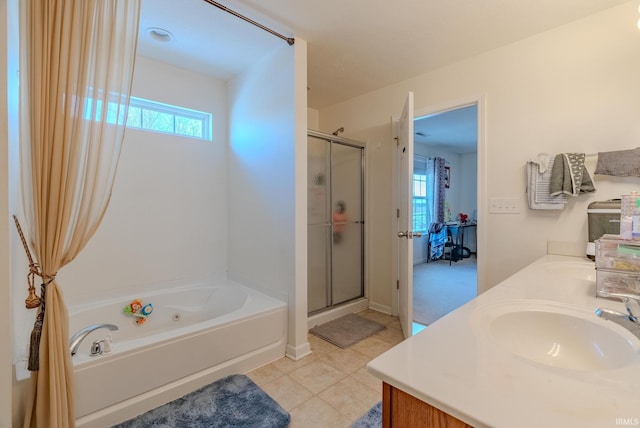 bathroom featuring vanity, plenty of natural light, and plus walk in shower