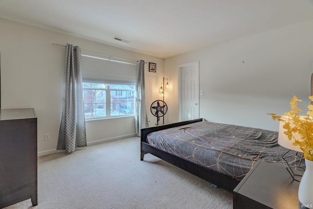 bedroom with light carpet