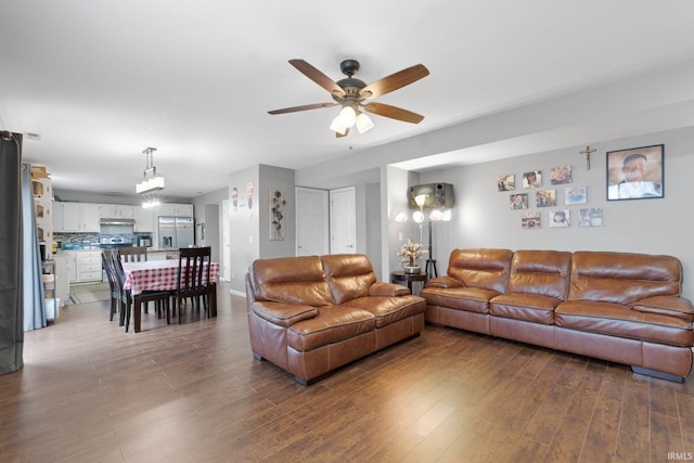 living room with hardwood / wood-style floors and ceiling fan