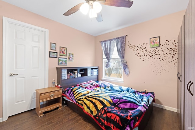 bedroom featuring dark wood-type flooring and ceiling fan