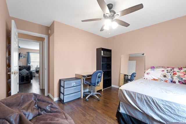 bedroom with ceiling fan and dark hardwood / wood-style floors