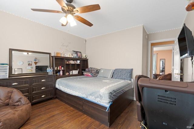 bedroom featuring dark wood-type flooring and ceiling fan