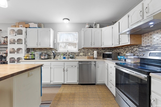 kitchen featuring white cabinetry, appliances with stainless steel finishes, sink, and decorative backsplash