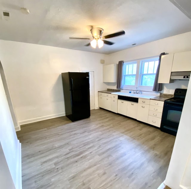 kitchen with sink, light hardwood / wood-style flooring, ceiling fan, black appliances, and white cabinets