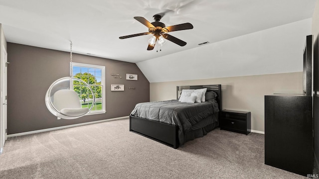 carpeted bedroom featuring lofted ceiling and ceiling fan