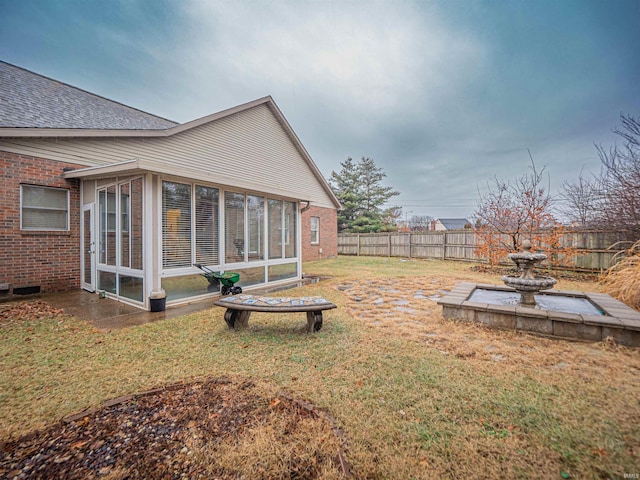 view of yard featuring a sunroom