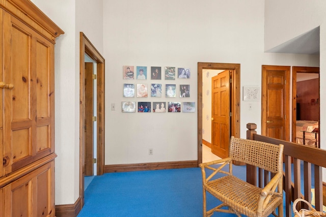 hall featuring light colored carpet