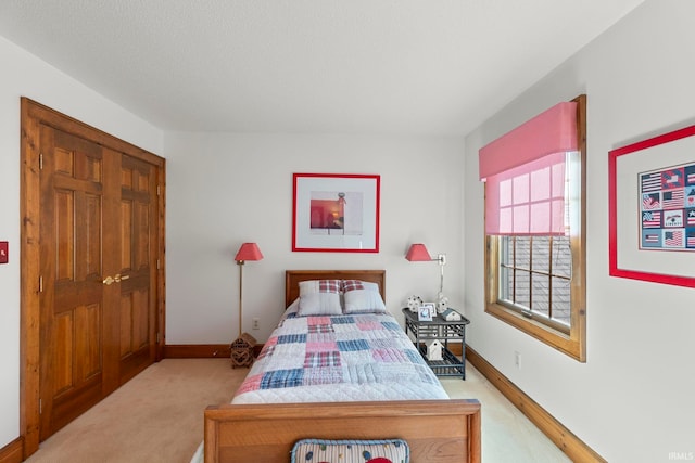 bedroom with light colored carpet