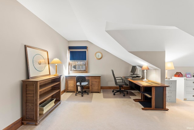 office space featuring vaulted ceiling and carpet floors