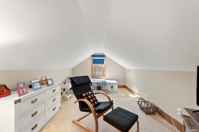 living area with vaulted ceiling and light colored carpet