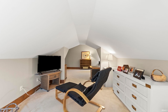 office area featuring vaulted ceiling and light carpet