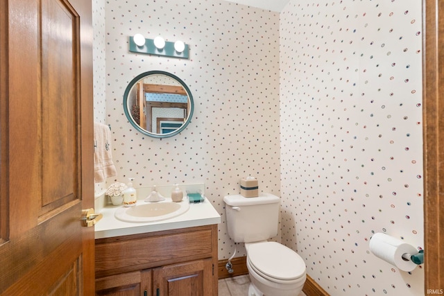 bathroom with tile patterned floors, toilet, and vanity