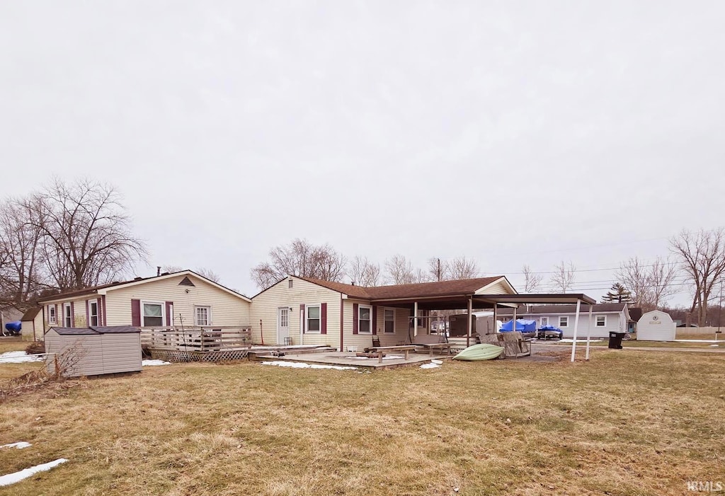 back of house with a lawn