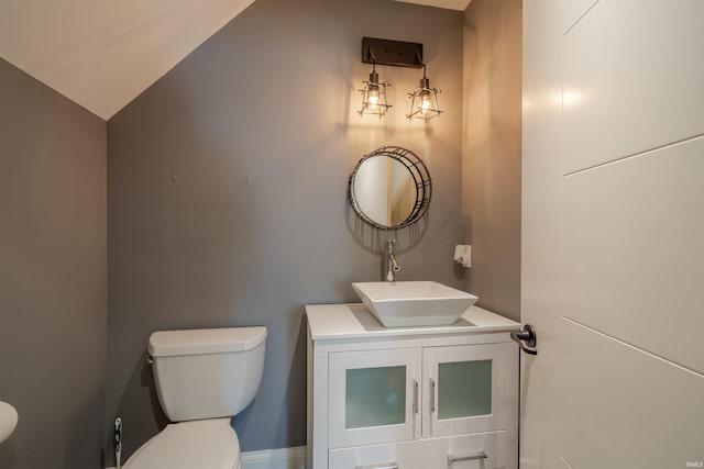 581 Silverdale Rd, Rockport, IN 47635 - bathroom with lofted ceiling, vanity, and toilet