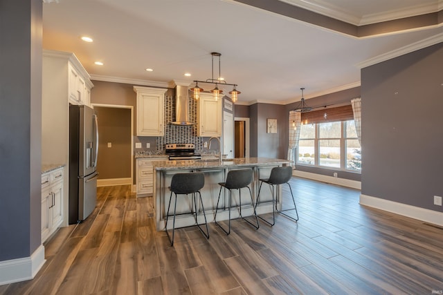 581 Silverdale Rd, Rockport, IN 47635 - kitchen featuring light stone counters, stainless steel appliances, an island with sink, and wall chimney exhaust hood