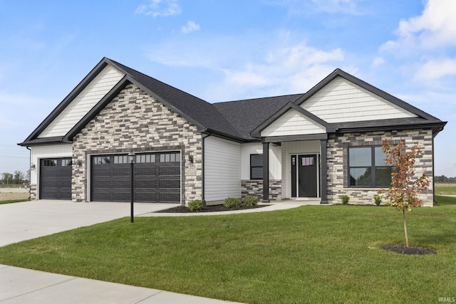 craftsman-style house featuring a garage and a front lawn