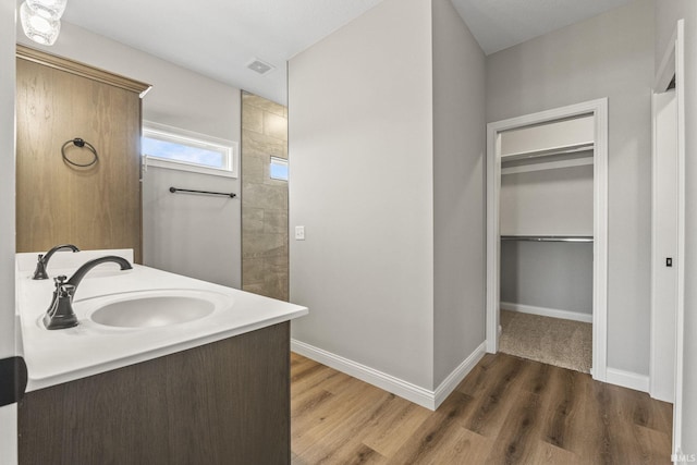 bathroom with vanity and hardwood / wood-style floors