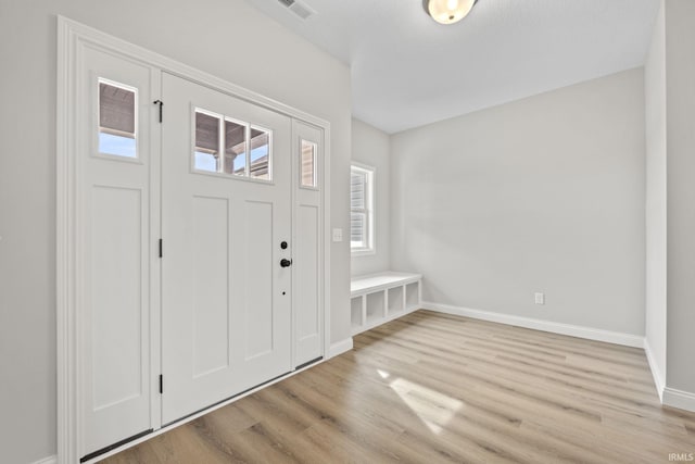 foyer entrance with light hardwood / wood-style floors