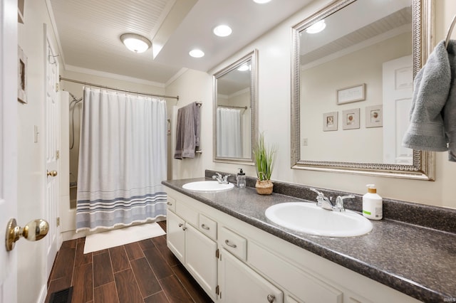 bathroom featuring crown molding, shower / bath combo, and vanity