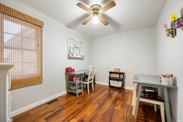 office space with dark wood-type flooring and ceiling fan