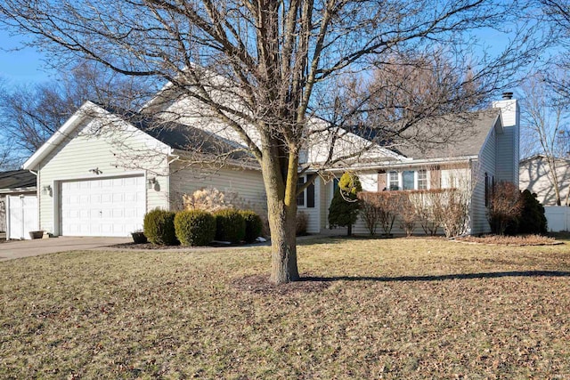 ranch-style house with a garage and a front lawn