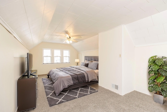 carpeted bedroom featuring vaulted ceiling and ceiling fan