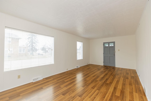 spare room featuring hardwood / wood-style floors