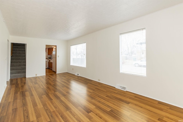 spare room featuring hardwood / wood-style floors