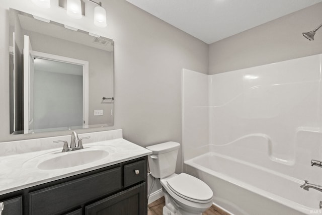 full bathroom with vanity, toilet, shower / bath combination, and wood-type flooring