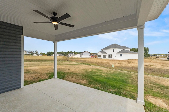 view of patio featuring ceiling fan